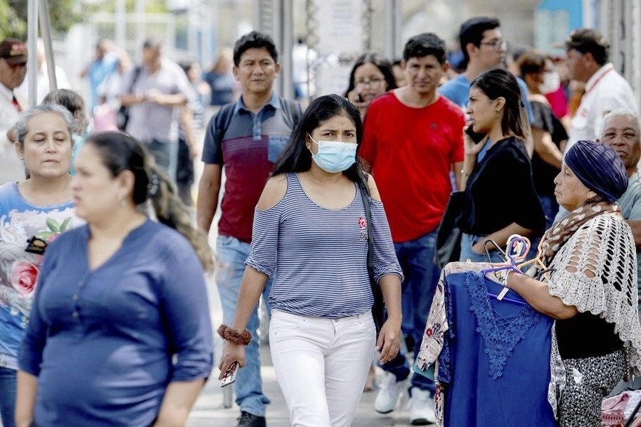 Lima, Aug. 29, 2020 (Xinhua) -- A woman wearing a face mask walks on a street in Lima, Peru, on March 6, 2020. (Xinhua/Renato Pajuelo/ANDINA/IANS)